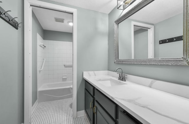 full bathroom featuring tile patterned flooring, visible vents, baseboards, toilet, and vanity