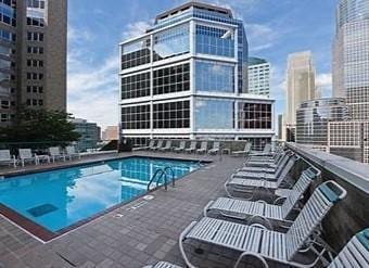 pool with a patio and a city view