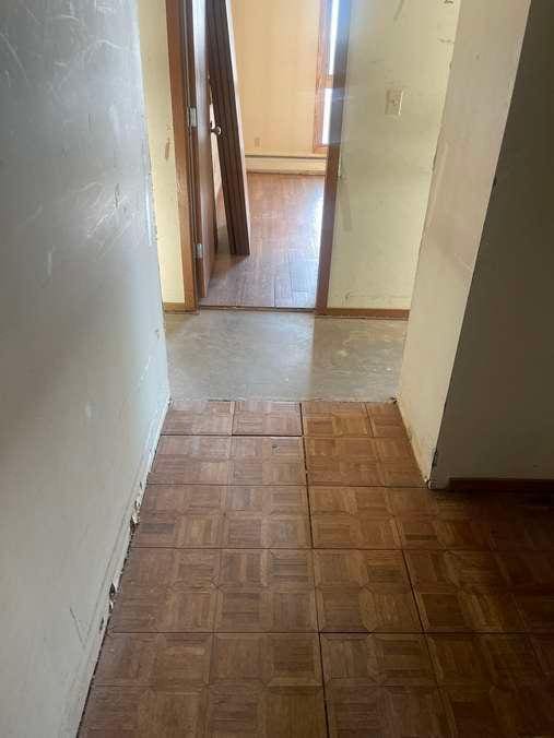 hallway featuring a baseboard radiator