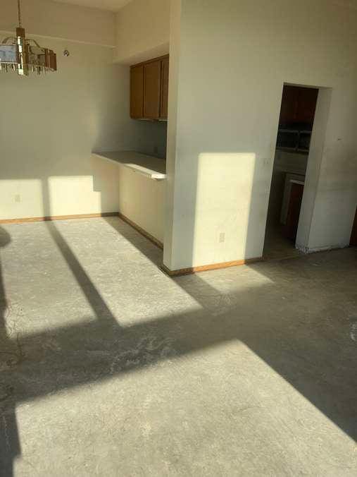 interior space with concrete floors and baseboards