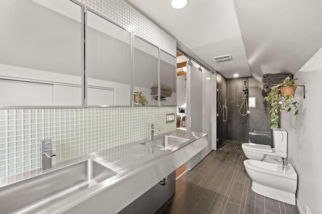 full bath featuring a stall shower, toilet, visible vents, and a sink