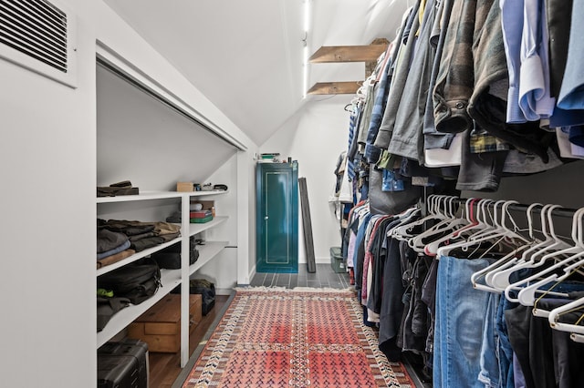 walk in closet featuring wood finished floors and visible vents