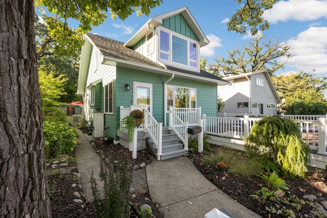 view of front of property featuring board and batten siding and a deck