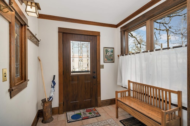 entryway featuring light tile patterned flooring, baseboards, a wealth of natural light, and ornamental molding