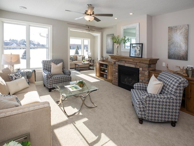 25338 Farmstead Ln, Wyoming, MN 55092 - carpeted living room featuring recessed lighting, a ceiling fan, a water view, and a fireplace