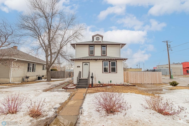 view of front of house featuring fence