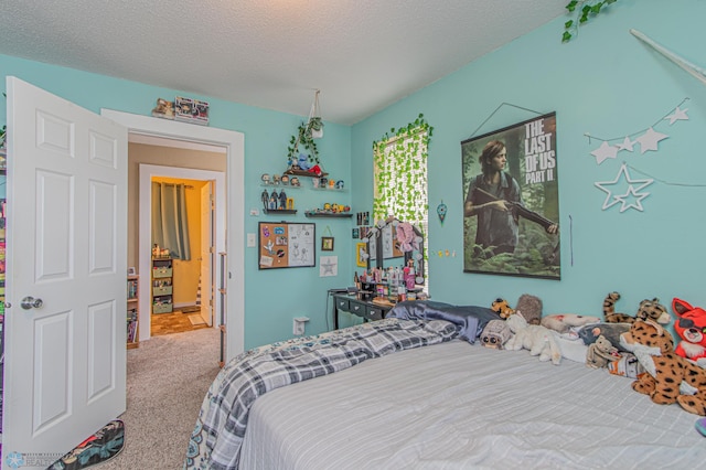 carpeted bedroom featuring a textured ceiling