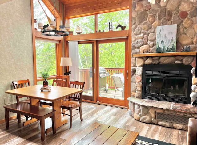 sunroom / solarium featuring a fireplace