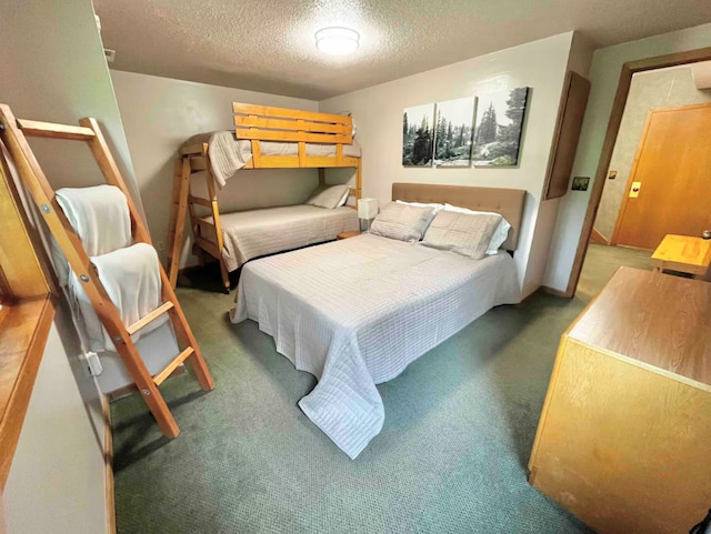 carpeted bedroom featuring a textured ceiling