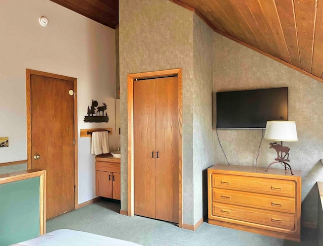 carpeted bedroom featuring high vaulted ceiling, wood ceiling, and baseboards