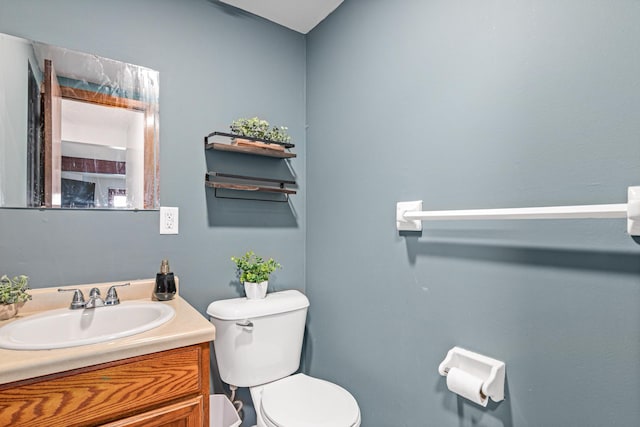 half bath with vanity and toilet