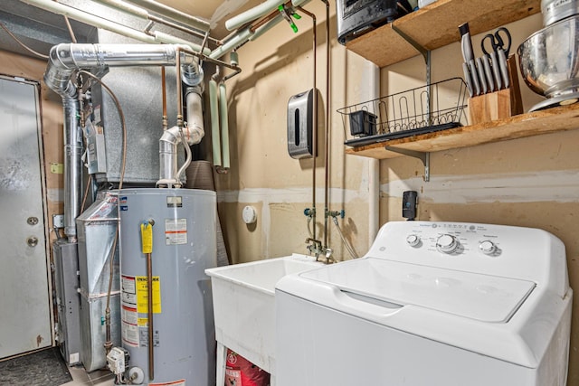 laundry room featuring washer / clothes dryer, gas water heater, a sink, and laundry area