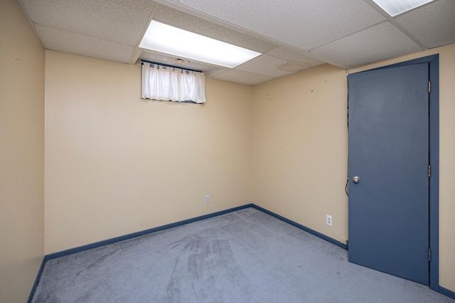 spare room with visible vents, a paneled ceiling, baseboards, and carpet floors