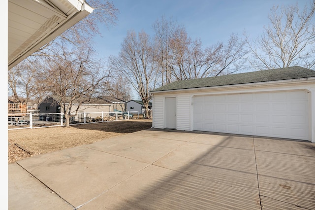 detached garage with fence