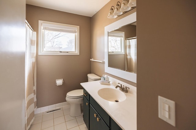 bathroom featuring visible vents, toilet, tile patterned flooring, baseboards, and vanity