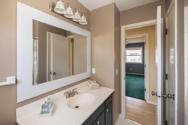 bathroom with vanity and baseboards