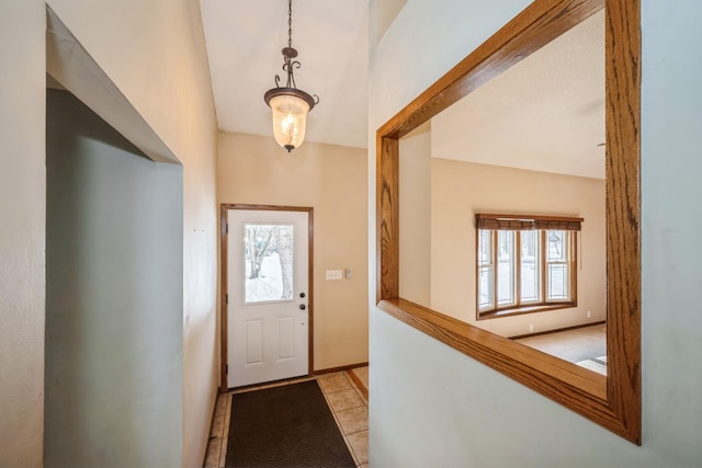 foyer entrance featuring light tile patterned floors