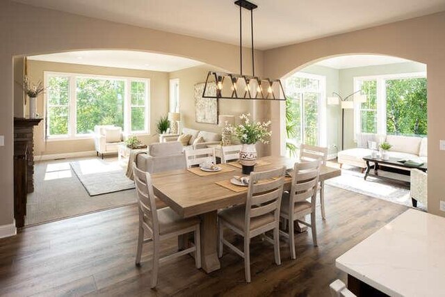 dining space featuring a chandelier and wood finished floors