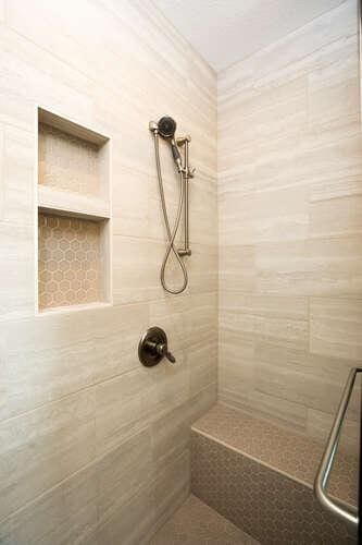 bathroom with tiled shower