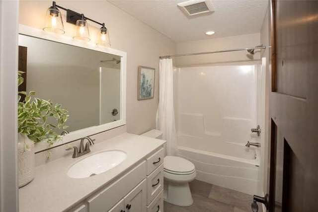 bathroom with toilet, shower / bath combo, visible vents, and vanity