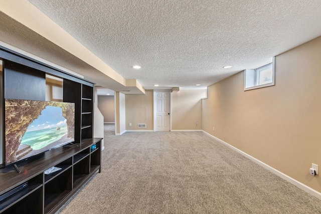 basement with recessed lighting, visible vents, carpet flooring, a textured ceiling, and baseboards