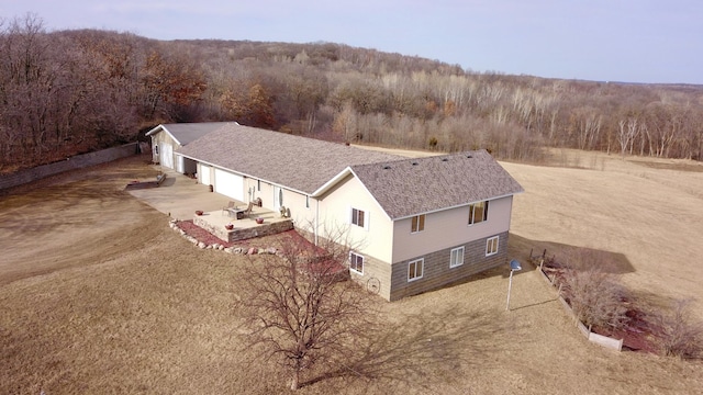 drone / aerial view with a forest view