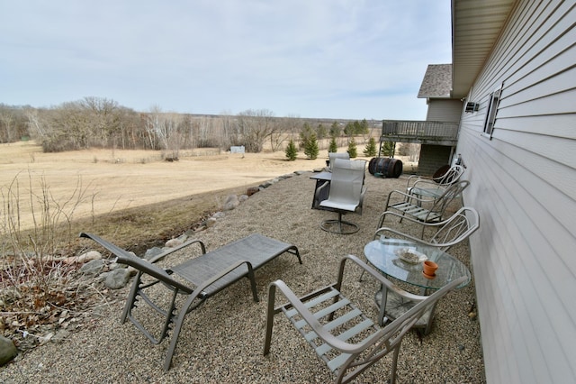 view of yard with a patio area and a rural view