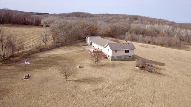 drone / aerial view featuring a view of trees