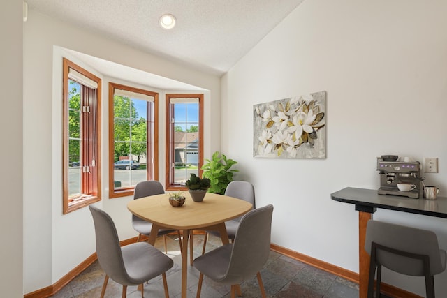 15436 70th Ave N, Maple Grove, MN 55311 - dining room featuring baseboards, lofted ceiling, recessed lighting, and a textured ceiling