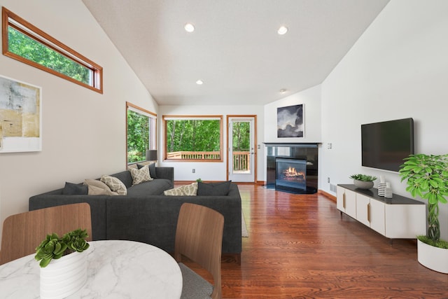 15436 70th Ave N, Maple Grove, MN 55311 - living room featuring healthy amount of natural light, wood finished floors, a tile fireplace, recessed lighting, and vaulted ceiling