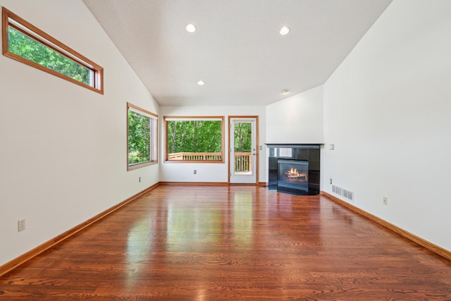15436 70th Ave N, Maple Grove, MN 55311 - unfurnished living room with plenty of natural light, wood finished floors, a fireplace, recessed lighting, and baseboards