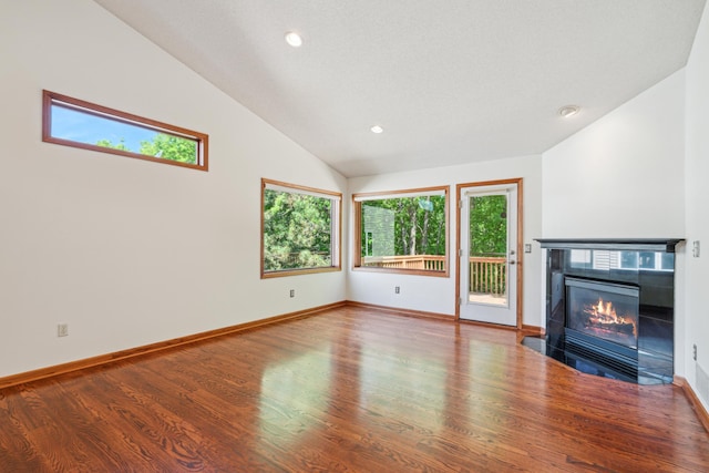 15436 70th Ave N, Maple Grove, MN 55311 - unfurnished living room with vaulted ceiling, wood finished floors, a fireplace, recessed lighting, and baseboards
