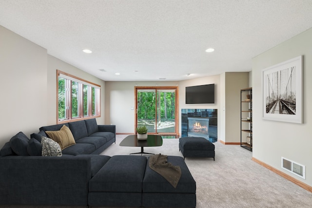 15436 70th Ave N, Maple Grove, MN 55311 - living area with light carpet, baseboards, a fireplace, recessed lighting, and a textured ceiling