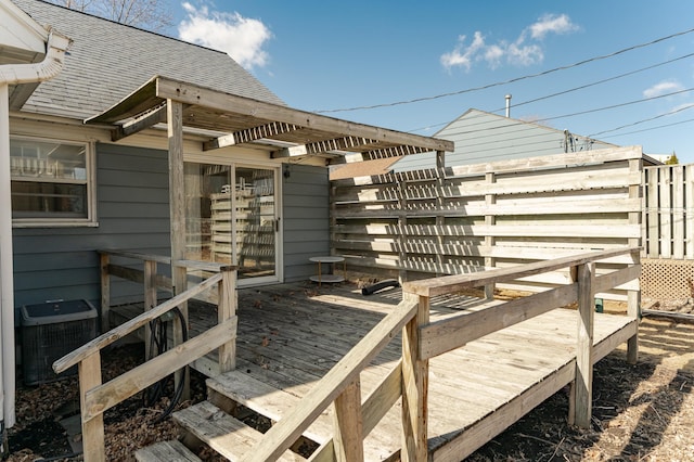 wooden terrace with central air condition unit and fence