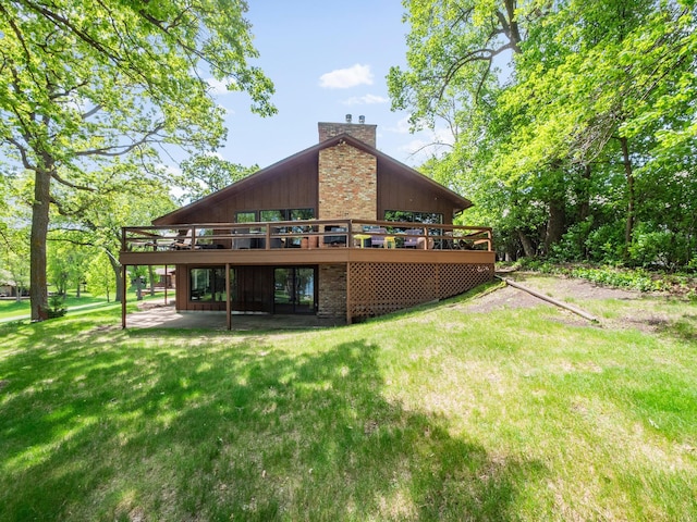2904 Le Homme Dieu Vw NE, Alexandria, MN 56308 - rear view of property featuring a wooden deck, a chimney, a yard, and a patio