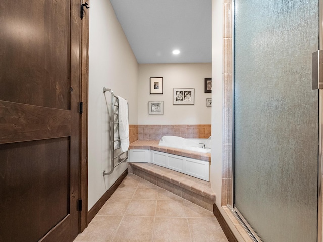 2904 Le Homme Dieu Vw NE, Alexandria, MN 56308 - bathroom featuring tile patterned floors, a bath, a stall shower, recessed lighting, and baseboards