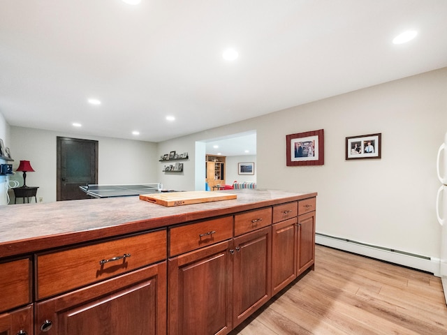 2904 Le Homme Dieu Vw NE, Alexandria, MN 56308 - kitchen featuring baseboard heating, light wood-style flooring, recessed lighting, light countertops, and brown cabinetry