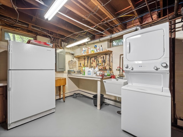 2904 Le Homme Dieu Vw NE, Alexandria, MN 56308 - basement featuring freestanding refrigerator, estacked washer and dryer, electric panel, and concrete block wall