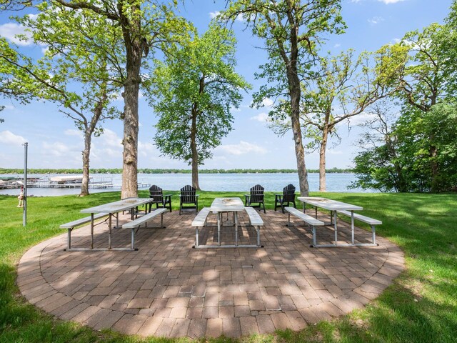 2904 Le Homme Dieu Vw NE, Alexandria, MN 56308 - view of home's community featuring a patio area, a yard, and a water view