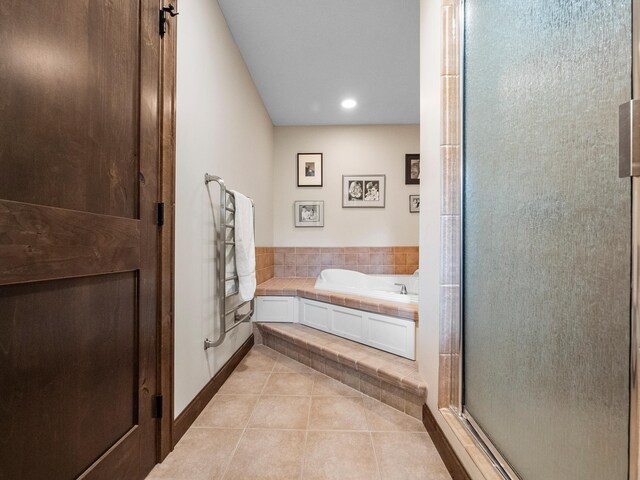 2904 Le Homme Dieu Vw NE, Alexandria, MN 56308 - bathroom with tile patterned flooring, a garden tub, a shower stall, recessed lighting, and baseboards