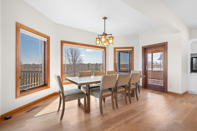 1502 Epperstone Enclave, Byron, MN 55920 - dining space with a chandelier and light wood-style floors
