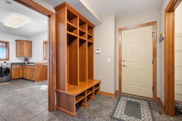 1502 Epperstone Enclave, Byron, MN 55920 - mudroom featuring washer / dryer and baseboards