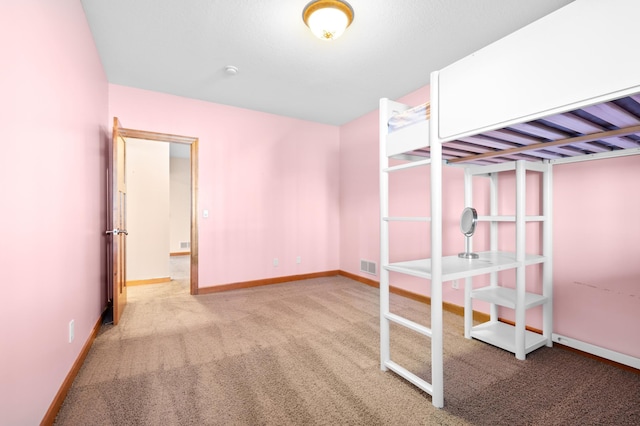 1502 Epperstone Enclave, Byron, MN 55920 - unfurnished bedroom featuring carpet and baseboards
