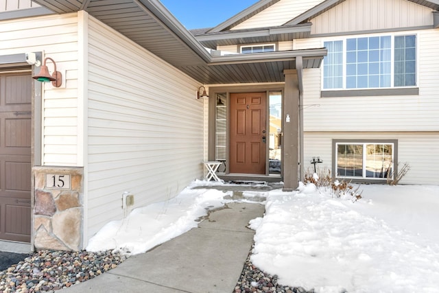 view of snow covered property entrance