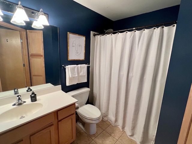 full bathroom with a shower with shower curtain, vanity, toilet, and tile patterned floors