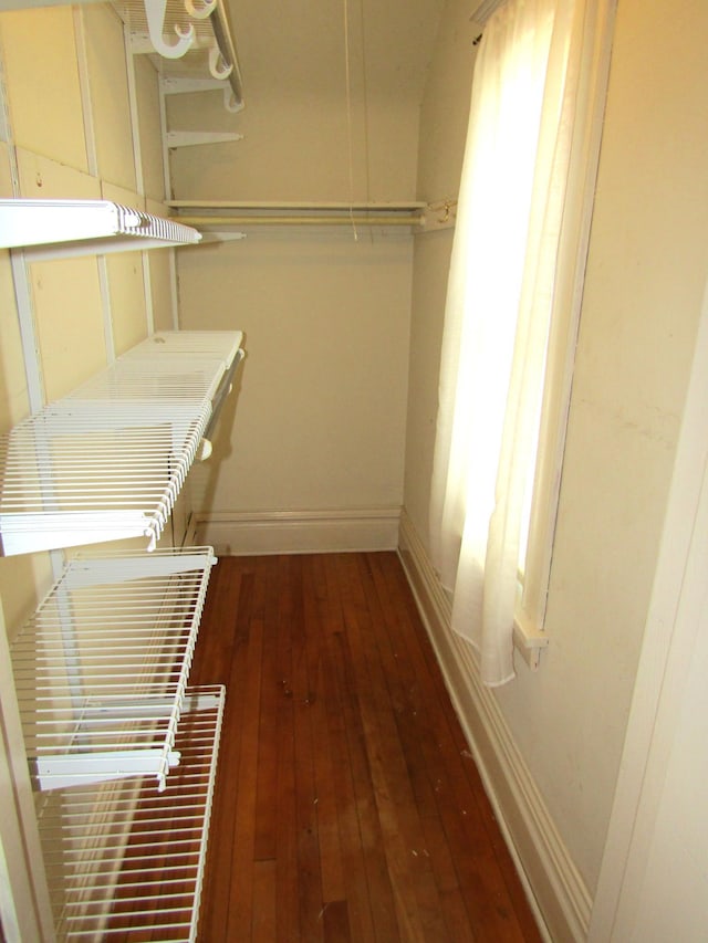 spacious closet featuring hardwood / wood-style floors