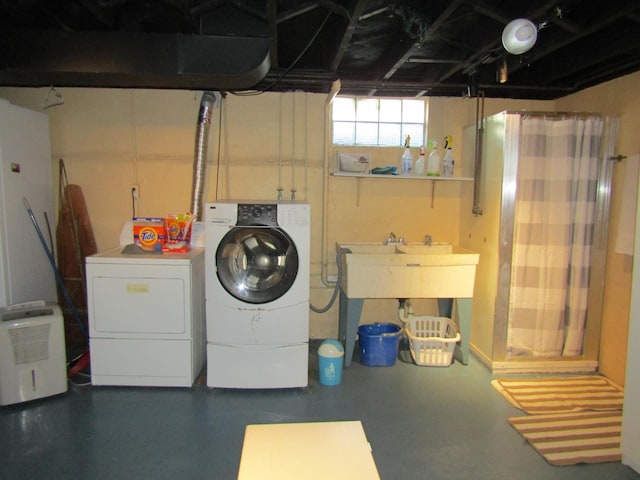 clothes washing area with laundry area and washing machine and clothes dryer