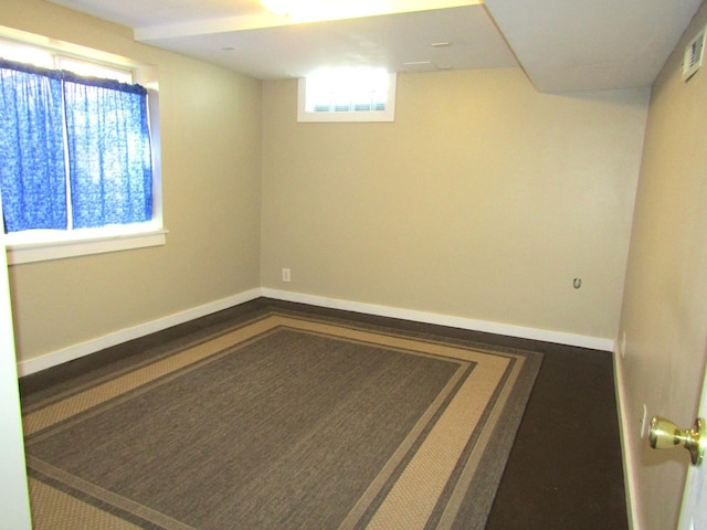 empty room featuring baseboards