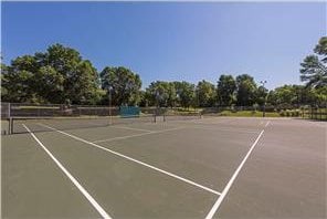 view of tennis court featuring community basketball court