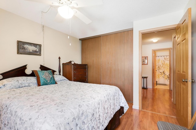 bedroom featuring a ceiling fan and light wood-style floors